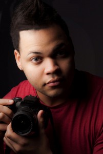 Headshot of Matt Agosto with a camera