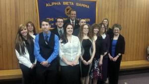 Group of Business Honor Society Inductees with Mayor Hawke in front of the Alpha Beta Gamma banner