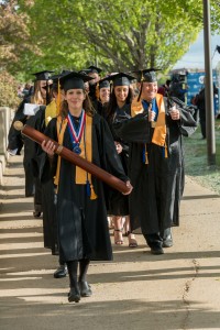 Graduates walking toward the gym entrance