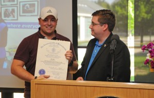 John day at the podium with Representative Jon Zlotnik