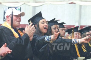 Graduates clapping during the commencement ceremony