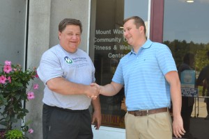 Steve Washkavich shakes Jared Swerzenski's hand