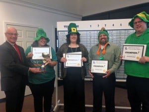 The Blarney Brainiacs, winners of the second annual Mount Wachusett Community College Alumni Network quiz night, accepts the trophy from Greater Gardner Chamber of Commerce President and CEO Jim Bellina, who served as one of the event’s three judges. Team members, from left, are Jessica Connors, Jennifer Welch and Ramon Gonzalez of MWCC’s Division of Access & Transition, and Brian Scales of RCAP Solutions.