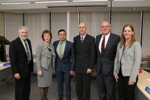 Group photo of Carlos E. Santiago, Tina Sbrega, Jasson Alvarado Gomez, Dr. James Vander Hooven, Richard A. Cella, and Sheila Harrity