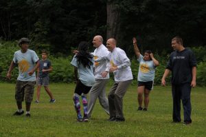 Doug Petersen and President Vander Hooven playing in a game of ultimate frisbee