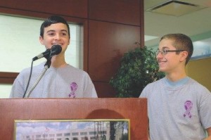 Holiday Spreaders speaking at a podium